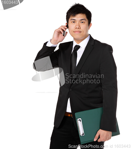 Image of young business man with mobile phone
