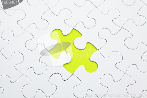 Image of Jigsaw puzzle with green piece missed