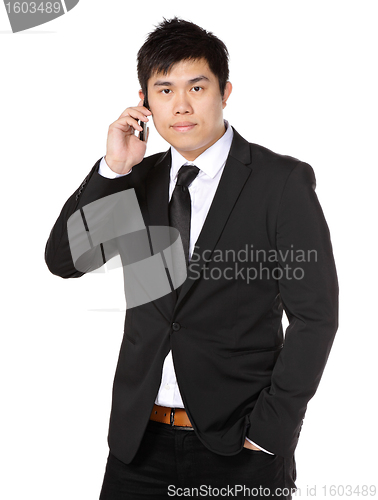 Image of young business man on the phone