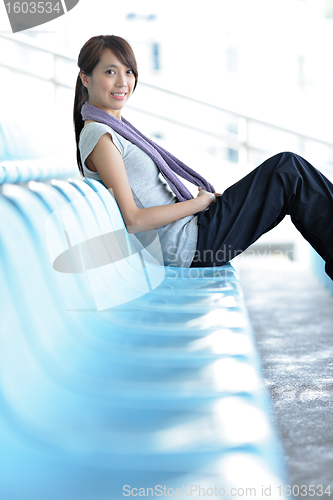 Image of sporty girl sit in sport arena