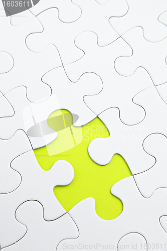 Image of Jigsaw puzzle with green piece missed