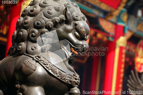 Image of bronze lion in chinese temple