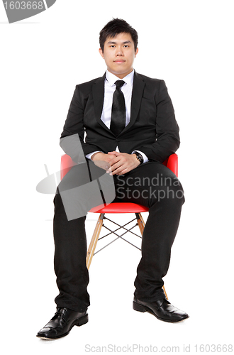 Image of young asian business man sitting