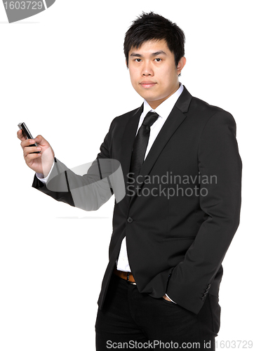 Image of young business man with mobile phone