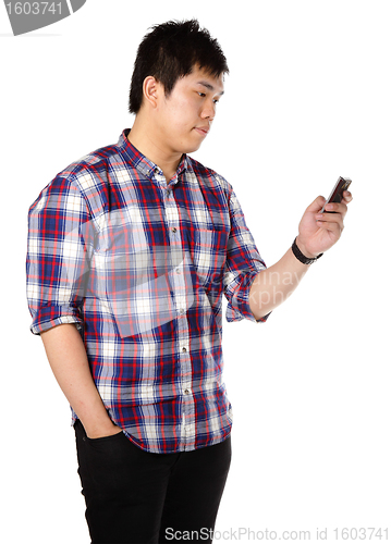 Image of man sms on cell phone