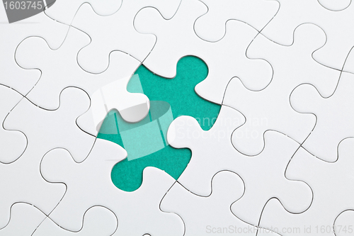 Image of puzzle with green piece missed