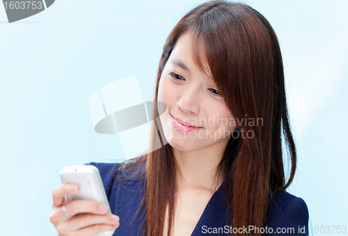 Image of asian woman using cellphone