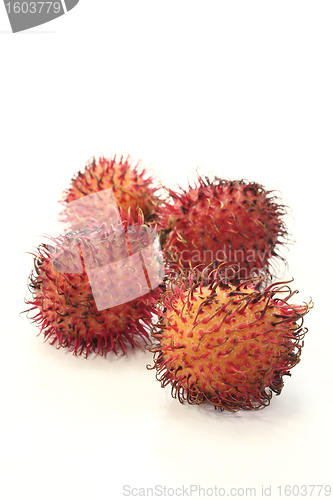 Image of four fresh rambutan