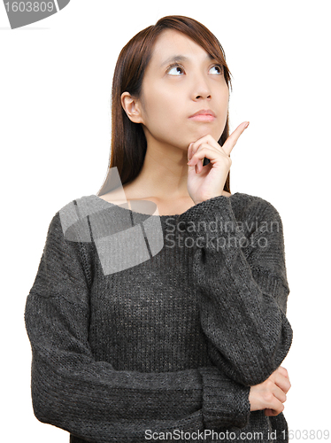 Image of thoughtful woman looking up