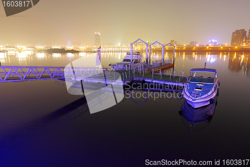 Image of Taipei pier with city at night