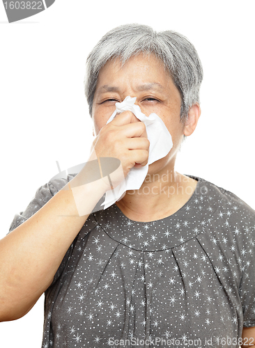 Image of sneezing mature woman