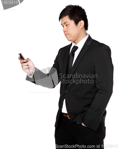 Image of young business man with mobile phone