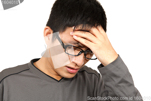 Image of man holding head in pain