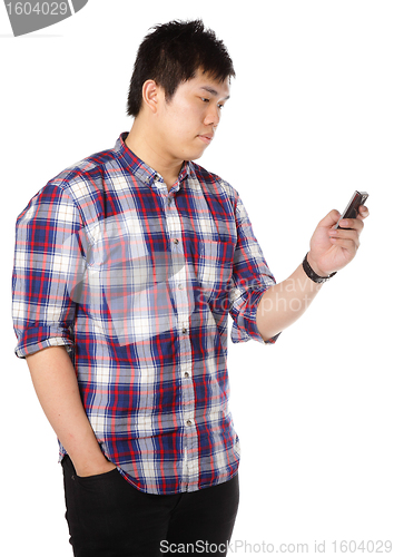 Image of man sms on mobile phone