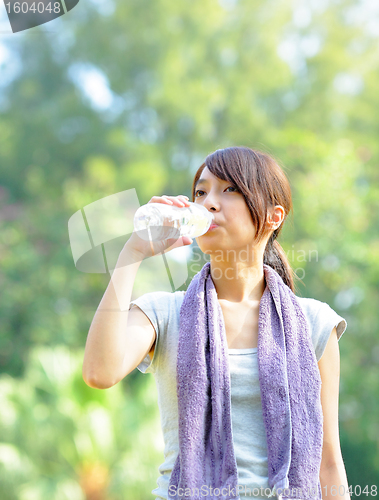 Image of woman drink water after sport