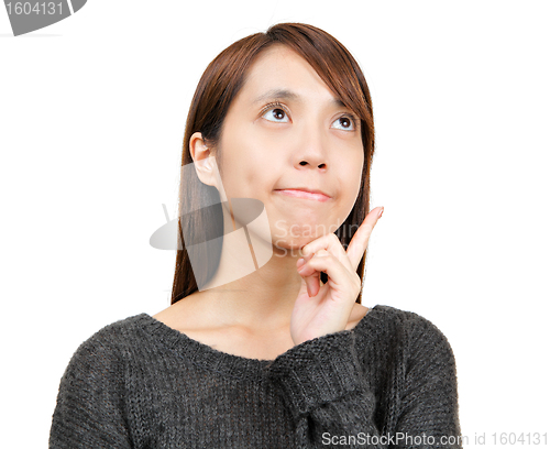 Image of thoughtful woman looking up