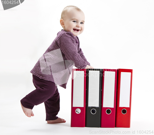 Image of young child with ring file