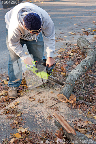 Image of Cleaning Up Storm Damage with a Chainsaw