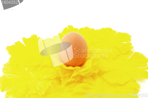 Image of Egg Easter symbol with yellow decorative flowers