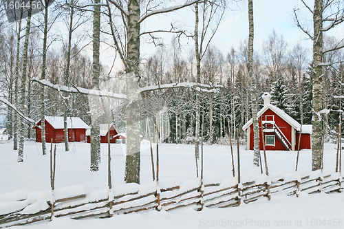 Image of Swedish winter landscape with red wooden houses