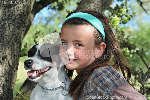 Image of little girl and dog