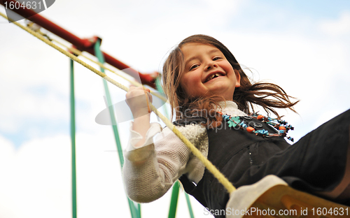 Image of swinging girl