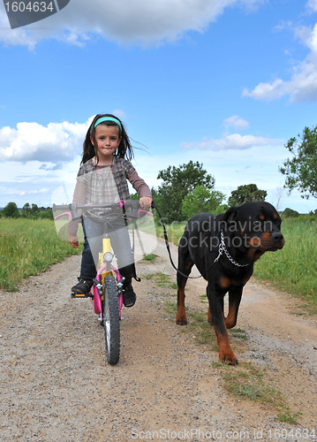 Image of little girl and her dog