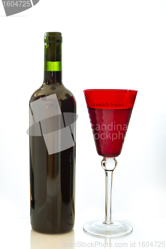 Image of red wine bottle with glass