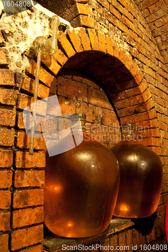 Image of demijohn in wine cave