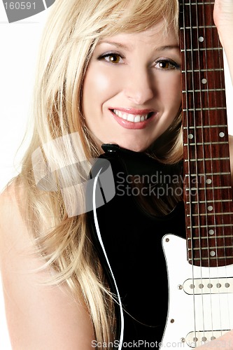 Image of Female leaning on her guitar
