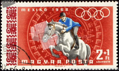 Image of Jockey riding horse on post stamp