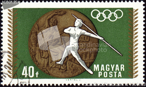 Image of Javelin throwin and Olympic medal on post stamp
