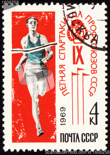 Image of Post stamp shows running sportsman