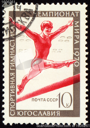 Image of Post stamp shows female gymnast on balance beam