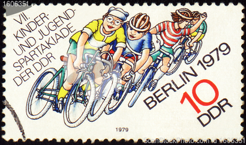 Image of Group of young cyclists on post stamp