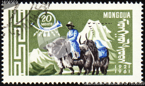 Image of Post stamp with man in national Mongolian costume on yak