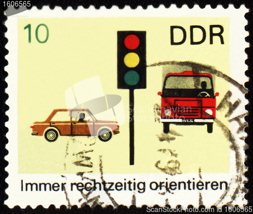 Image of Post stamp with car, truck and light signal