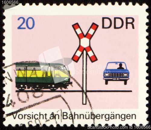 Image of Post stamp with car on a railway crossing