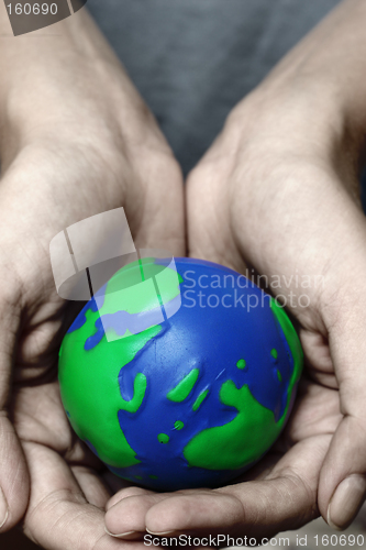 Image of Hands and Planet