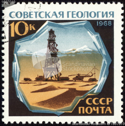 Image of Drilling rig in desert on post stamp