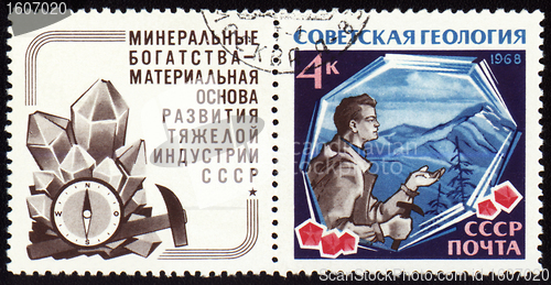 Image of Geologist with hammer on post stamp