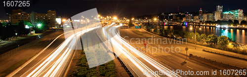 Image of Light Trails and Portland City Skyline at Night