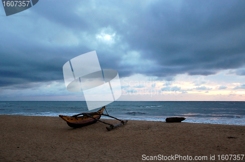 Image of Empty Beach on Cloudy Day at Sunset