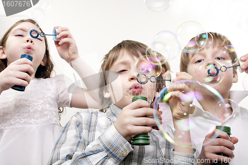 Image of children blowing bubbles
