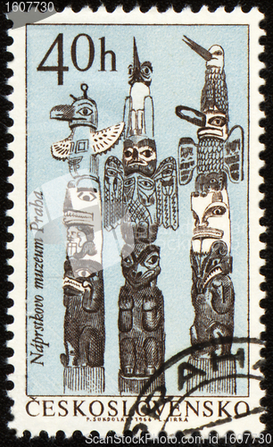 Image of American indian totem poles on post stamp