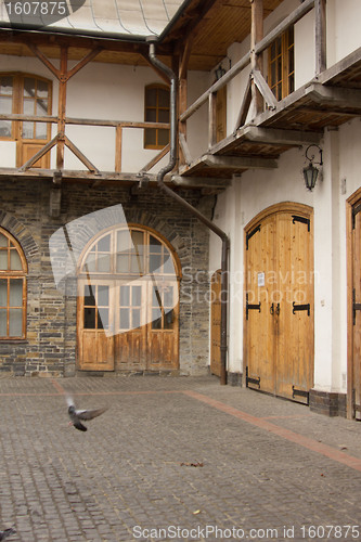 Image of Patio of the ancient city with pigeons 