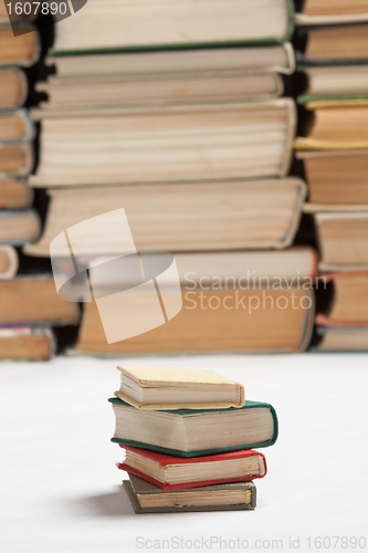 Image of vintage small books, on white background