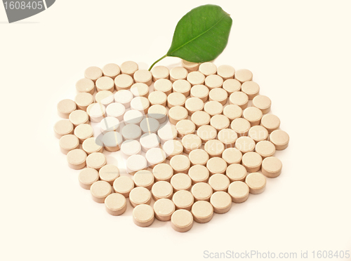 Image of Pills medicine in shape apple with green leaf bio