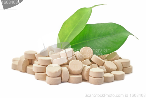 Image of Bio pills medicine with green leaf