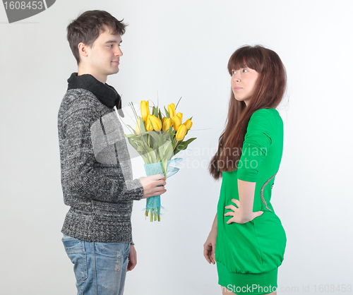 Image of happy young couple with bouquet flowers